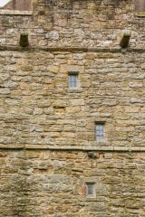 Elsdon Tower, Narrow lancet windows on the west facade