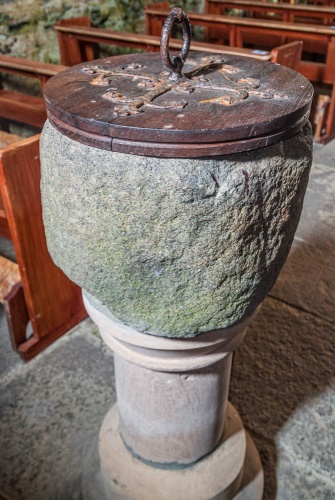The roughly carved font