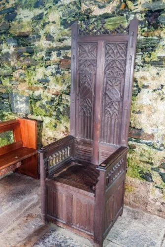 A high-backed chair inside the church