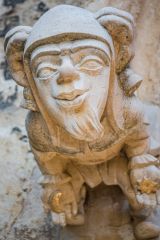 Carved head, west facade