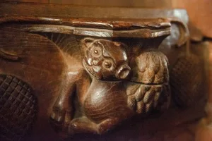 Misericord of a muzzled beast