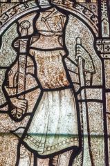14th-century stained glass figure of a knight