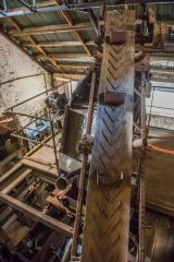 A long conveyor belt runs through the mine buildings