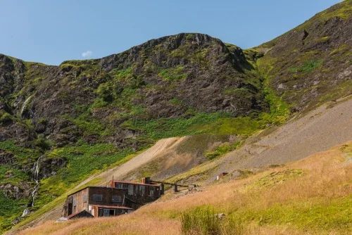 The mine buildings appear in the distance beneath Force Crag