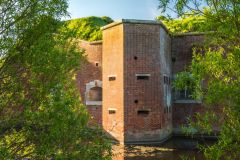 An angle tower with gun ports, south-west frontage