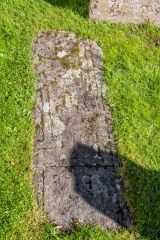 A medieval carved slab in the churchyard