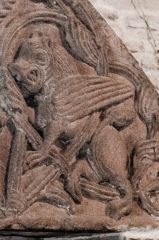 Winged lion carving on the tympanum