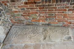 Medieval coffin lid set into the porch floor