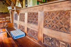 A beautifully-carved pew