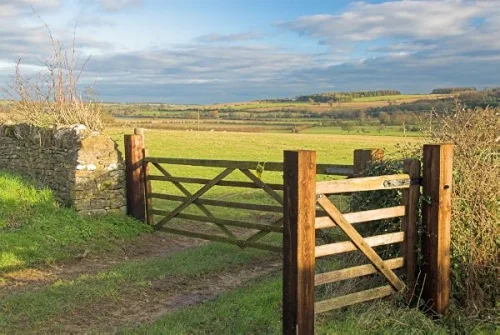 Footpaths lead across a raised causeway to Little Barrington.
