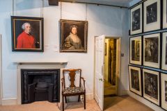 Paintings by Gainsborough line the walls