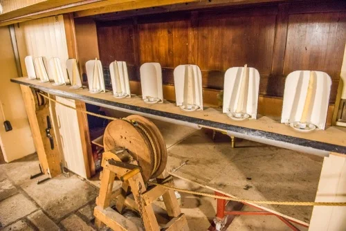 The 'candle float' footlight mechanism under the stage 