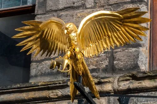 The gilded 'gled' over the entrance