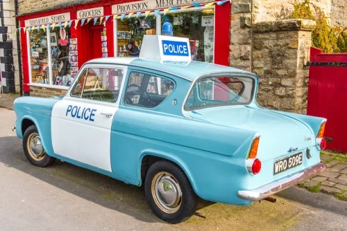 'Heartbeat' police car in front of 'Aidensfield Stores'