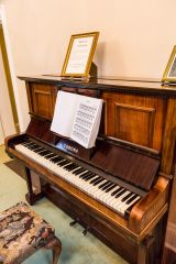 A piano ready to be played by visitors