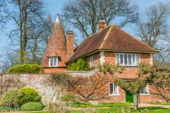 A picturesque oast house beside the walled garden