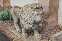 A stone lion guards the front entrance