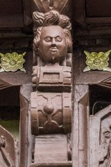 A smug figure with a goatee