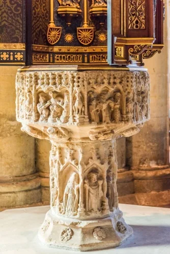 The richly carved 15th-century font