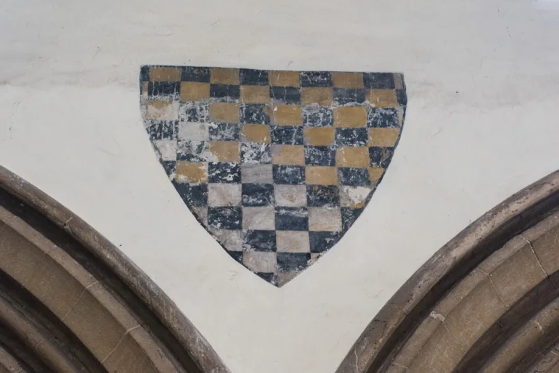 Painted coat of arms on the nave arcade
