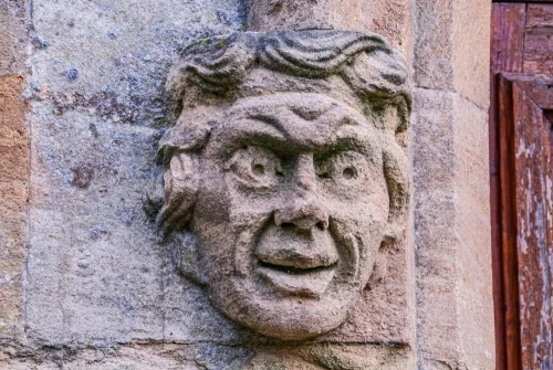 Carved head, west doorway