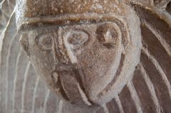 Another of the carved heads on the font