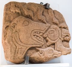 Beasts attacking a human figure