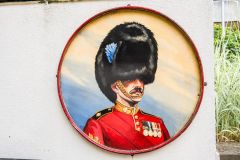 Guardsman painting outside the museum