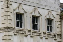 Elegant first floor windows of the Small Mansion
