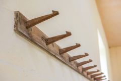 Hat pegs, north wall