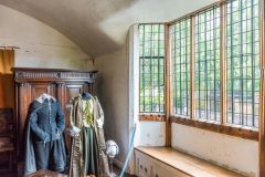 A mullioned window illuminates the Master Bedroom