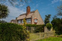 A pretty thatched cottage near the church