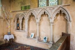 The beautifully carved 14th century sedilia and piscina