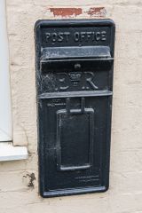 An unusual black post box