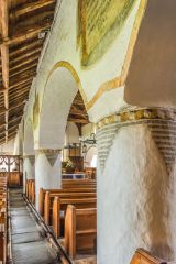 The whitewashed and painted nave arcade
