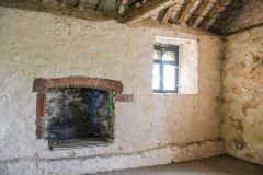 The fireplace and south-east window