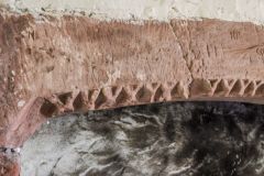 Dogtooth moulding on the 13th-century fireplace