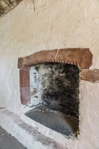 The 13th-century fireplace