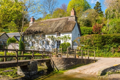A thatched cottage by the ford in Helford
