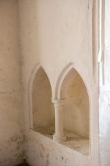 A double piscina in the chancel