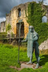 A modern sculpture guards the barbican entrance