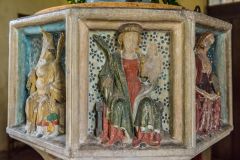 Painted carvings on the font bowl