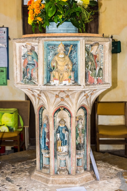 The richly decorated 15th century font