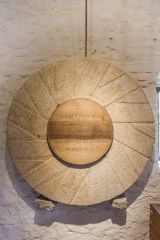 Millstone 'plaque' commemorating the mill's restoration