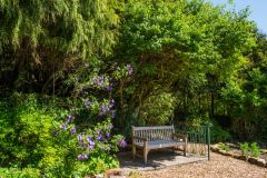A quiet bench near the garden entrance