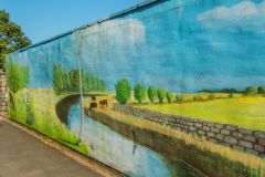 The route takes you past this striking mural in Ford Park