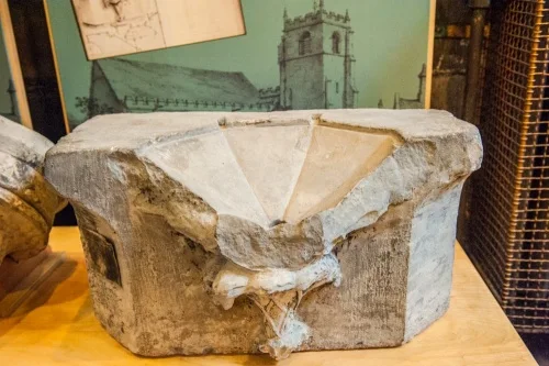 A broken medieval piscina