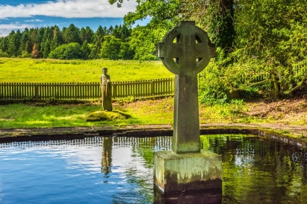 The cross and St Paulinus statue