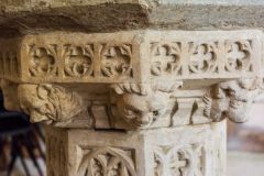 Honing, St Peter & St Paul, Grotesque carved heads on the font stem