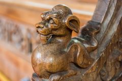 A serpent arm rest carving